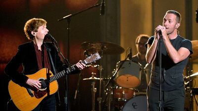 Recording artists Beck, left, and Chris Martin perform Heart Is a Drum onstage during The 57th Annual Grammy Awards. Kevork Djansezian / Getty Images / AFP