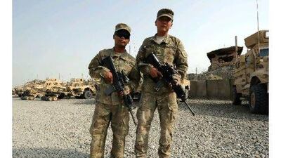 Darby Ortego, right, 25, and Von Bolante, left, both fighting for the United States army in Afghanistan. Both are from the Philippines, and have taken the military path to US citizenship. Ted Aljibe / AFP Photo