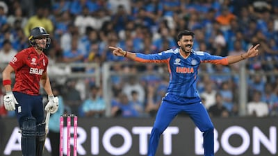 India's Axar Patel celebrates after taking the wicket of England batter Tom Banton. AFP