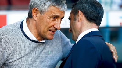 Quique Setien, left, has been installed as Barcelona's new manager, replacing Ernesto Valverde, right. EPA