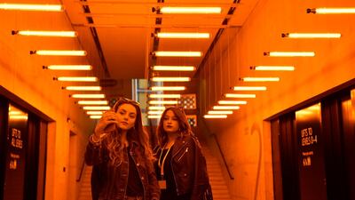 Women view Danish-Icelandic artist Olafur Eliasson's work 'A Room for One Colour' at the Tate Modern in London. Photo: EPA