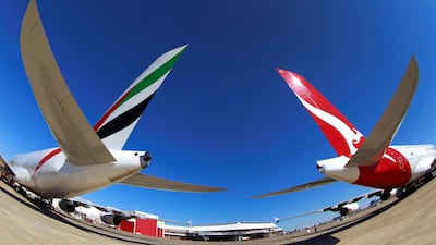 Emirates and Qantas A380 aircraft at Sydney airport. The Australian carrier will fly from the city to London via Singapore from next March. Daniel Munoz/Reuters