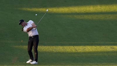Paul Casey of England hits from the fairway on the tenth hole. EPA