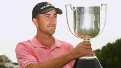 Geoff Ogilvy poses with championship trophy after winning the Australian PGA Championship - his first on Australian soil.