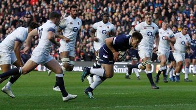 Huw Jones crosses the line for Scotland's first try in their Six Nations victory over England at Murrayfield on Saturday. Lee Smith / Reuters