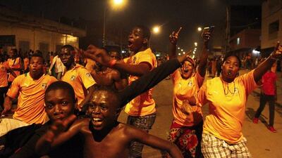Supporters of Ivory Coast celebrate in the streets of Abidjan on Sunday after their team beat Ghana in the Africa Cup of Nations final. Legnan Koula / EPA