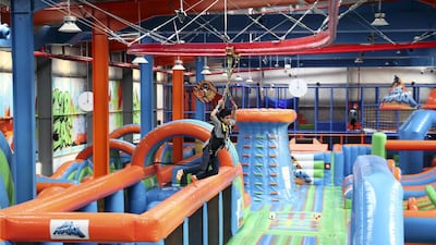 Khalid Al Salman, 9, enjoying the ZipZap zip line at Air Maniax. Pawan Singh / The National