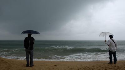 Residents watch waves along Haeundae beach in Busan as citizens brace for Typhoon Danas which is expected to pass through the coastal city early on October 9. Ted Aljibe/AFP Photo