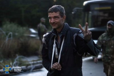 Mukhailo Dianov, a Ukrainian soldier who fought at the Azovstal steel plant in Mariupol, gives a victory sign after a POW exchange with Russia in September. Reuters