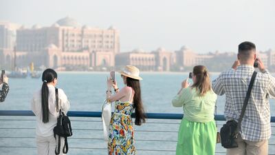 Tourists in Abu Dhabi. International visitors to the UAE will be able to use their home digital wallets for taxis and shopping. Khushnum Bhandari / The National