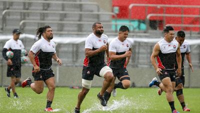 Japan's rugby team players practice ahead of their match against Scotland as Typhoon Hagibis approaches on Saturday. AP Photo