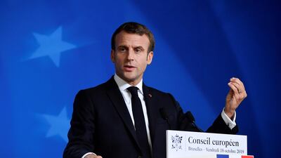 France's President Emmanuel Macron gestures as he addresses media representatives at a press conference during a European Union Summit at European Union Headquarters in Brussels on October 18, 2019. / AFP / John THYS