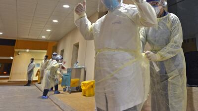 Health workers prepare to perform swab tests during a drive-through coronavirus testing campaign in Diriyah hospital in the Saudi capital Riyadh. AFP