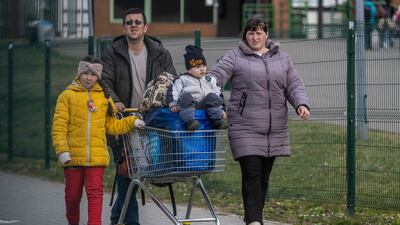 Refugees from Ukraine approach the border crossing into Poland in Medyka on April 7, 2022. AFP