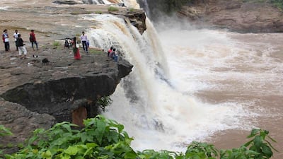 Local tourists sit at the Gira waterfall near Saputara hill in Gujarat. Siddharaj Solanki / Demotix