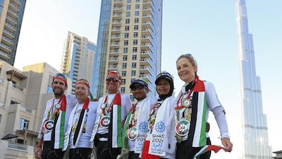 From left, seven runners in the Seven Emirates event Clemens Kastner, Servee Palmans, Wendelin Lauxen, Ekhman Mahmud, Aida Othman and Deirdre O’Leary, in Burj Plaza, Downtown Dubai yesterday. Sarah Dea / The National