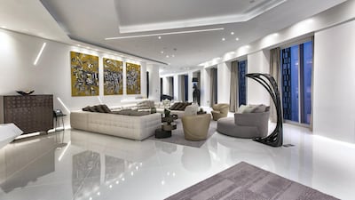 The angular lounge with the horse lamp in the background. Courtesy LuxuryProperty.com