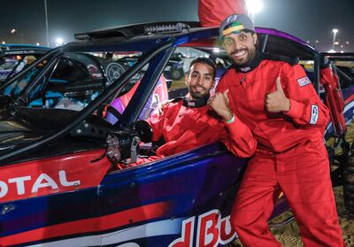 Nasser Al Hai and Rashid Al Dhaheri celebrate at taking first place ahead of arch rival Bin Dhahak. Victor Besa / The National