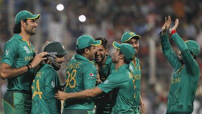 Pakistan players celebrate after Sharjeel Khan took a catch to dismiss Bangladesh’s Mashrafe Mortaza. (AP Photo/ Bikas Das)