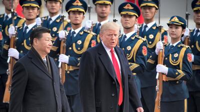 China's President Xi Jinping and US President Donald Trump in Beijing last year. Nicolas Asfouri / AFP