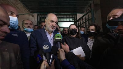 Former Fatah official Nasser al-Kidwa, center left, and Marwan Barghouti's wife, Fadwa, center right, leave the Palestinian Central Election Commission office after registering their joint list for the upcoming parliamentary election in May, in the West Bank city of Ramallah. AP Photo