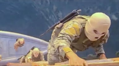 A screengrab from footage broadcast by Iranian state TV purportedly shows Iranian troops seizing the continer ship Francesca on Wednesday. Reuters