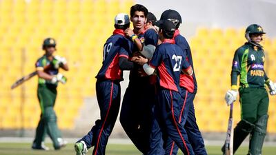 UAE team celebrates the dismissal of Sami Aslam of Pakistan at the Zayed Cricket Stadium. Satish Kumar / The National