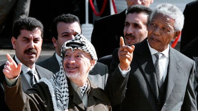 The Palestinian leader Yasser Arafat and Nelson Mandela meet in Cape Town, South Africa, in 1998. Mandela had praised Arafat as ‘a fellow freedom fighter’. AP Photo