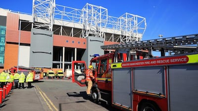 A fire engine arrives at the ground following a security alert and the subsequent abandonment of the Premier League match between Manchester United and AFC Bournemouth at Old Trafford on May 15, 2016 in Manchester, England. (Christopher Furlong/Getty Images)