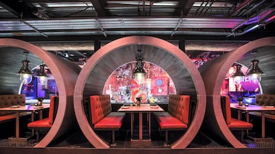 Private booths are dotted around the restaurant, across two floors that overlook the bar and restaurant, and bowling alley. Leslie Pableo / The National