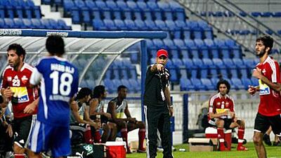 Mahdi Ali, right, lasted three months as coach of Al Ahli, a marked reversal to his success in charge of the UAE Olympic side.