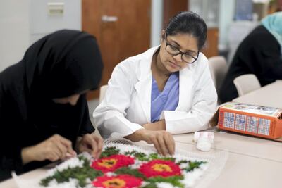 Mental health patients take part in an art therapy class organised at the Behavioral Sciences Pavilion in Sheikh Khalifa Medical City. Reem Mohammed / The National