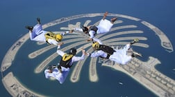 Emirati skydivers in kandouras form a belly formation above Skydive Dubai's Palm Dropzone. Photo: Skydive Dubai photographer/ Max Haim