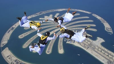 Emirati skydivers in kandouras form a belly formation above Skydive Dubai's Palm Dropzone. Photo: Skydive Dubai photographer/ Max Haim