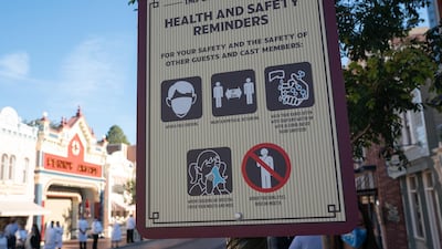 A health and safety reminders sign on Main Street USA during the reopening of the Disneyland theme park in Anaheim, California, US, on Friday, April 30, 2021. Bloomberg