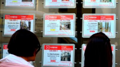 People look at advertisements displayed on a real state agency in Madrid. Rents in Spain are soaring post-crisis, fuelling concerns of a new "bubble" in a country still traumatised by the collapse of its housing sector. Photo: AFP