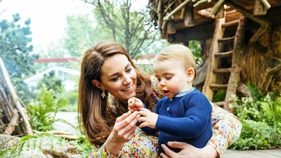 Catherine, Duchess of Cambridge, and her son Prince Louis play in the Adam White and Andree Davies co-designed garden before the RHS Chelsea Flower Show in London in 2019. AP Photo