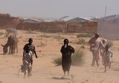 Sudanese refugees from Darfur arrived during a sandstorm at a refugee camp in Chad. Reuters