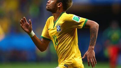 Neymar celebrates scoring his team's second goal on Monday night in a 4-1 win over Cameroon at the 2014 World Cup in Brasilia, Brazil. Clive Brunskill / Getty Images / June 23, 2014