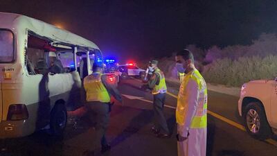 Police at the scene of the crash at Emirates Road on Saturday. Courtesy: Dubai Police