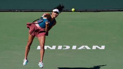 Emma Raducanu, of Britain, serves to Caroline Garcia, of France. AP Photo