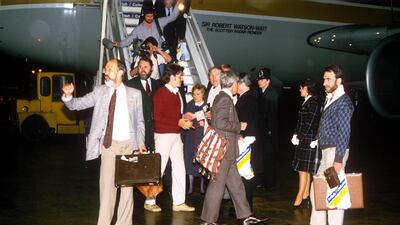 Terry Waite at Gatwick Airport with freed Libyan hostages in 1985. Shutterstock