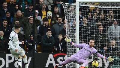 Wolves goalkeeper Jose Sa saves from United's Alejandro Garnacho in the first half. AP