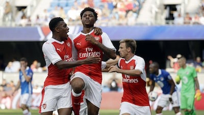 Arsenal forward Chuba Akpom, centre, celebrates his goal with teammate Alex Iwobi, left, during the second half of the MLS All-Star game against the MLS All-Stars on Thursday, July 28, 2016, in San Jose, California. Marcio Jose Sanchez / AP Photo