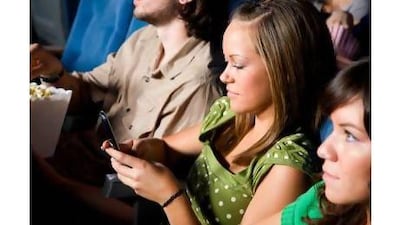 A reader says people should not disturb others movie-goers by taking or making calls on mobiles. iStockphoto