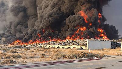 The fire broke out in a land plot used to store and process vehicle tyres. Courtesy Aletihad