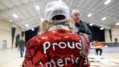 A worker checks in voters at a caucus site at the Horizon Events Centre. AFP
