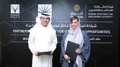Shurooq’s chairwoman Sheikha Bodour Al Qasimi, left, with the Emaar chief executive Mohamed Alabbar during the ceremony for the creation of Omran Properties. Courtesy Shurooq