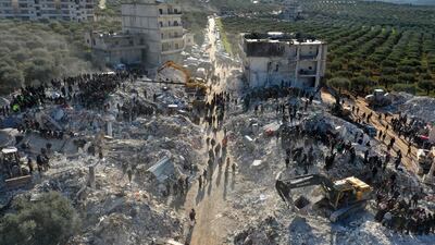 The rubble of buildings in the village of Besnaya in Syria's Idlib province. AFP