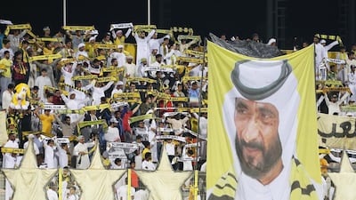 Al Wasl fans hold up banners during the match against Emirates, the final match Al Wasl played at the Zabeel Stadium. Pawan Singh / The National